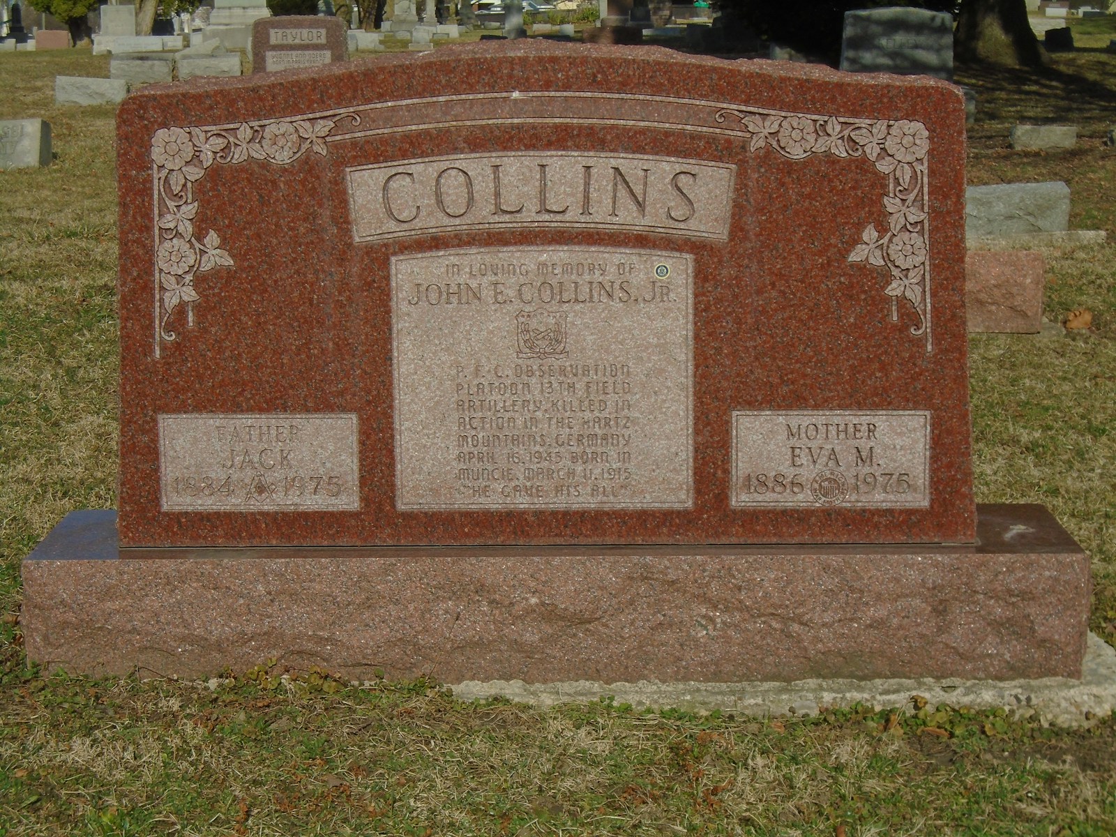 a headstone of a man and a woman in a cemetery