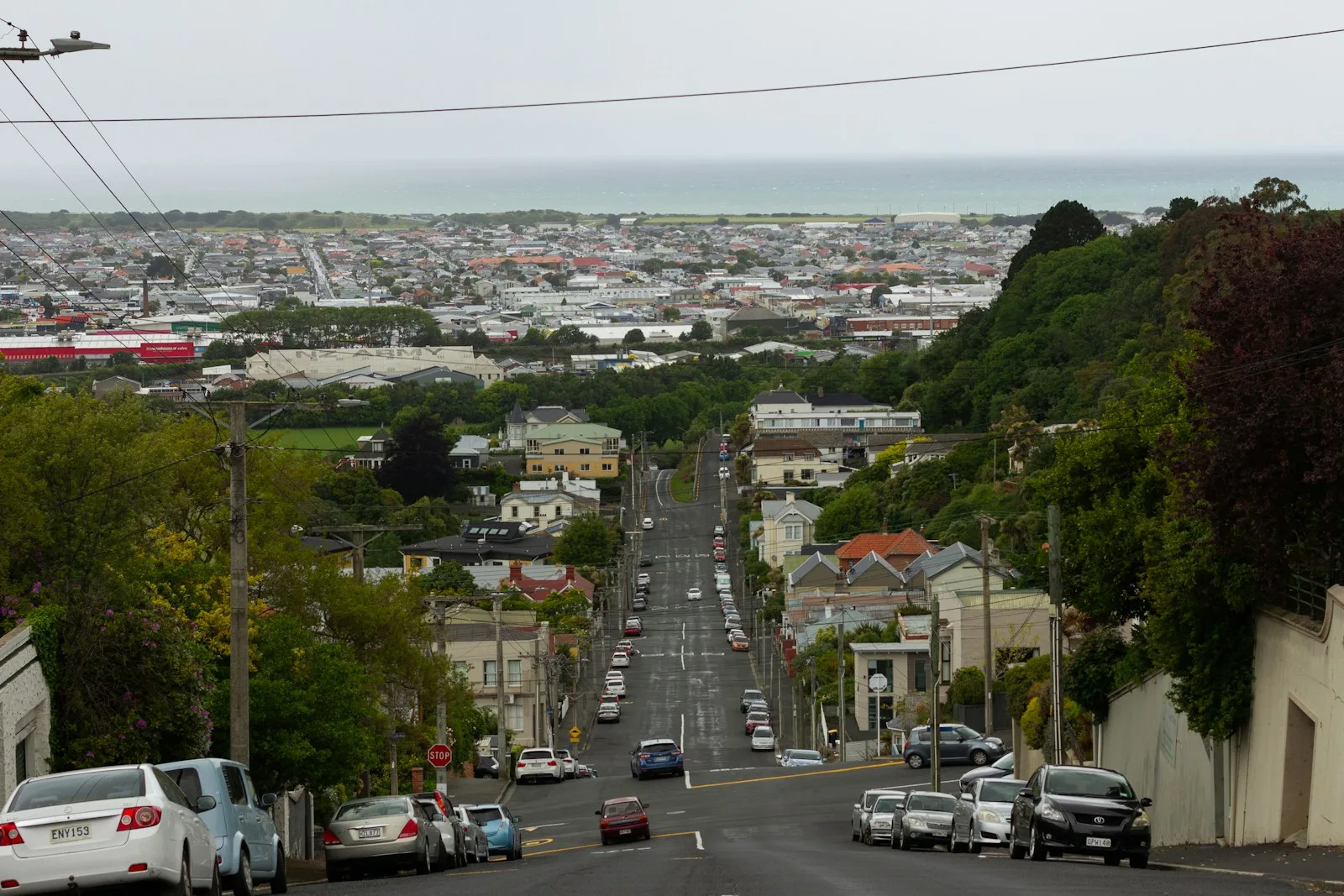 a city street with cars parked on both sides