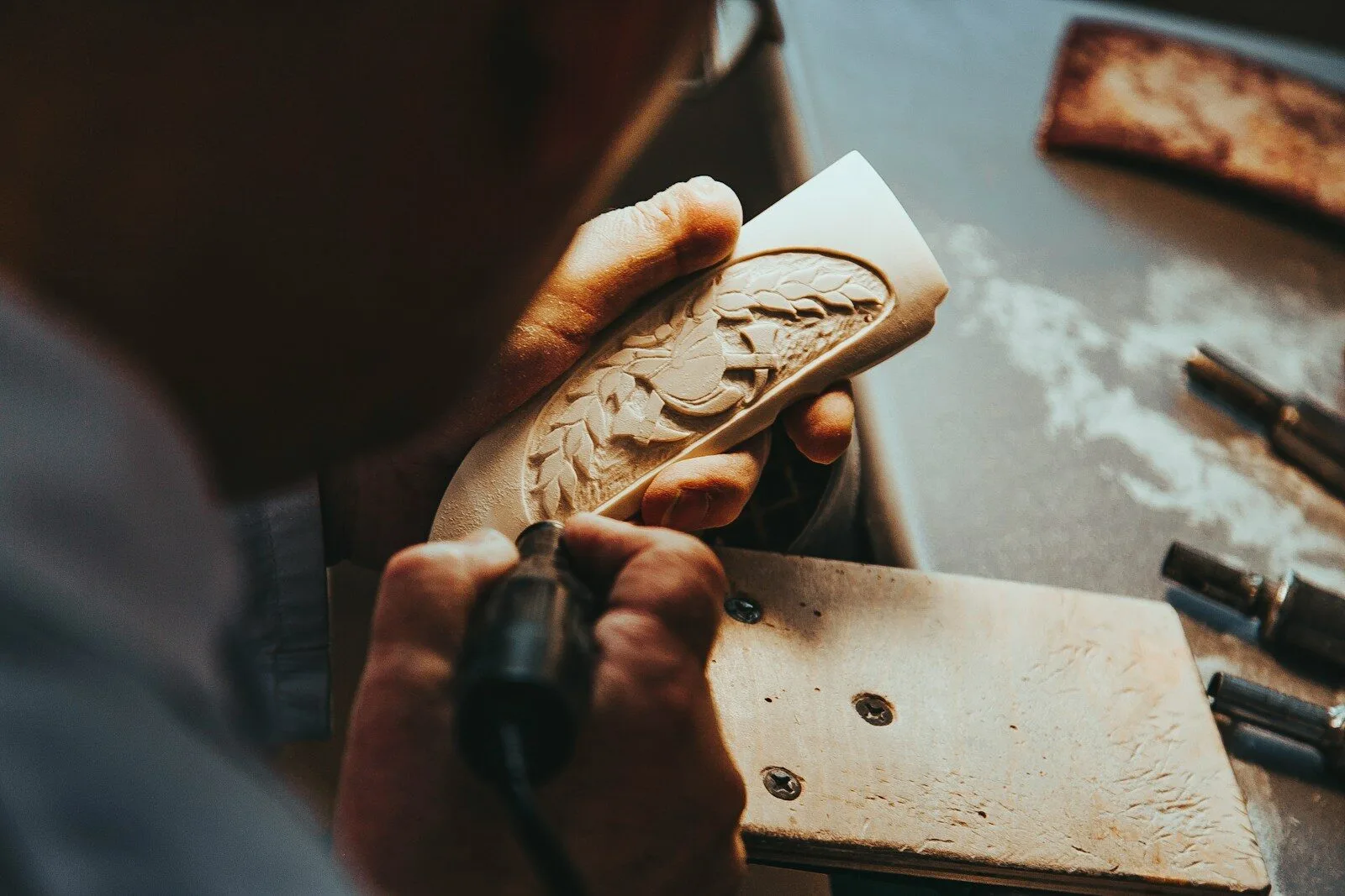 a man working on a shoe in a shoe shop