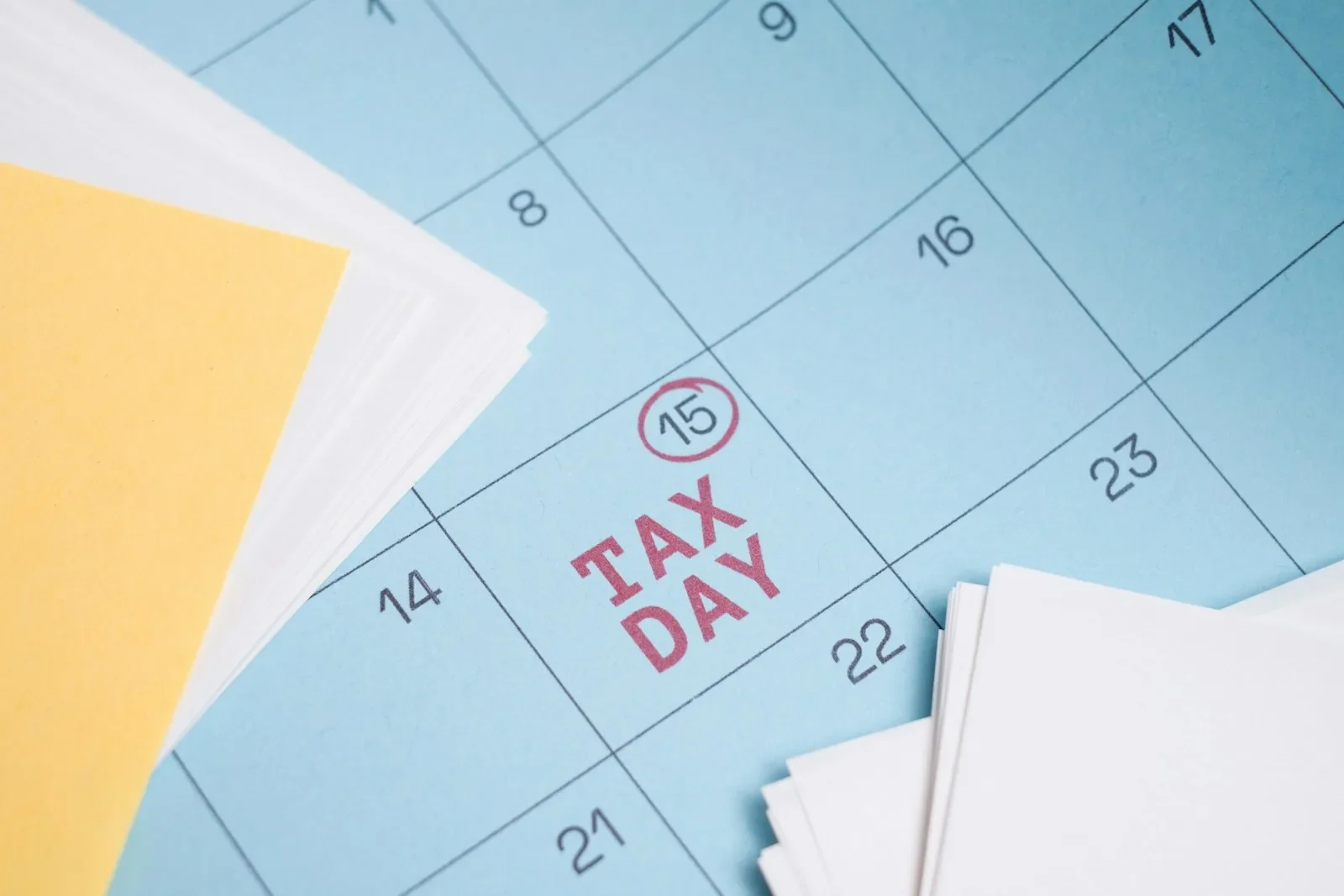 Calendar marked with "tax day" on the 15th.