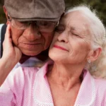 An older couple is embracing each other
